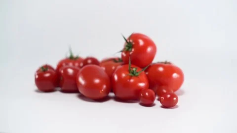 Tomatoes on white background, panning, shallow Depth of field 스톡 동영상 75779431