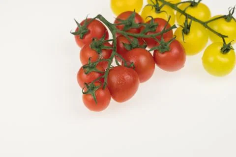 Tomatoes on a white background Stock Photos