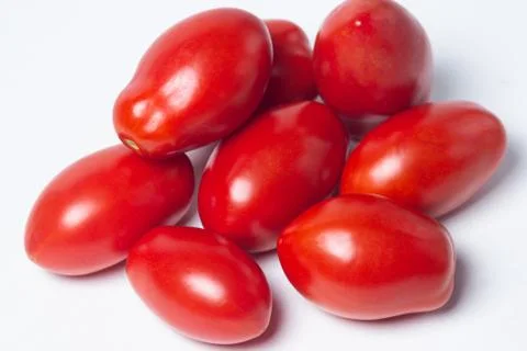 Tomatoes on a white background. Stock Photos