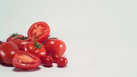 Tomatoes on white background, sliding 스톡 동영상 75776212