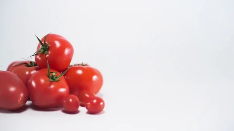 Tomatoes on white background, sliding, shallow Depth of field Video stock 75775384