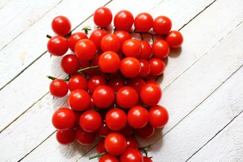Tomatoes on white boards Stock Photos