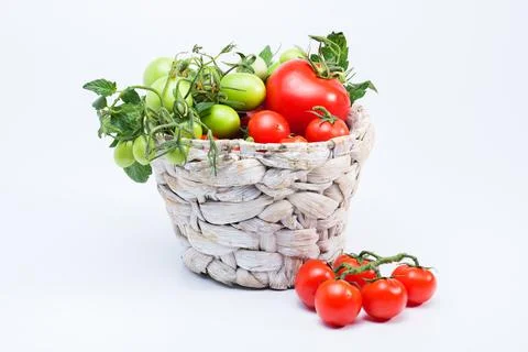 Tomatoes in a wicker basket Stock Photos