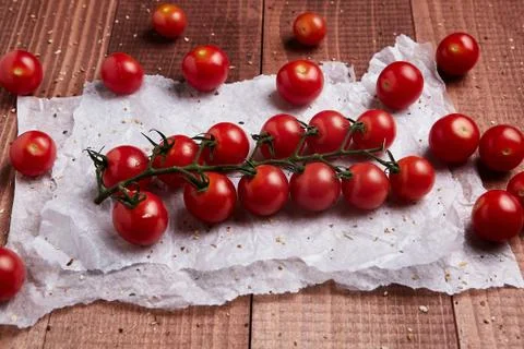 Tomatoes on a wooden background Stock Photos