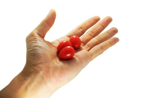 Tomatos on hand Foto stock