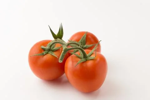 The tomatos on white background Stock Photos