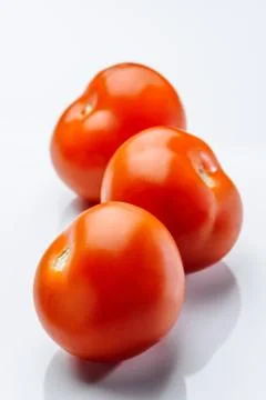 Tomatos on a white background Stock Photos