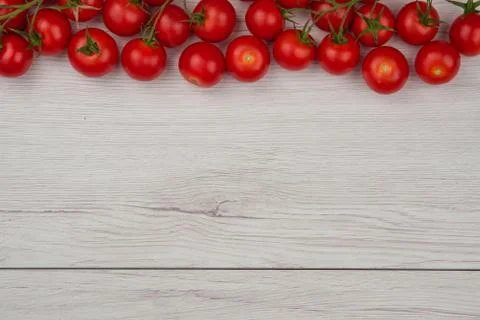 Tomatos on the white table Stock Photos