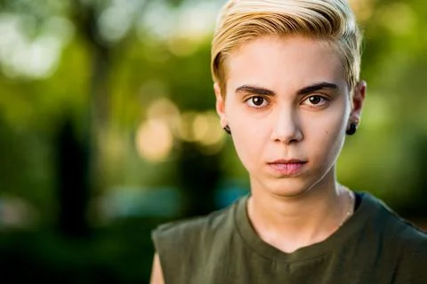 Tomboy androgynous lesbian non binary beauty in casual clothes gender lgtbi sex Stock Photos