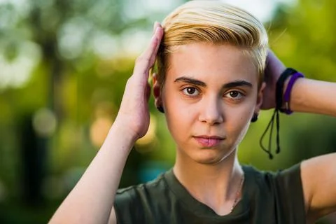 Tomboy androgynous lesbian non binary beauty in casual clothes gender lgtbi sex Stock Photos