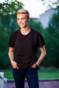 Tomboy androgynous lesbian non binary beauty in casual clothes gender lgtbi sex Stock Photos