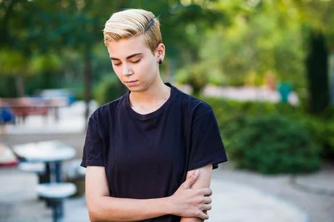 Tomboy androgynous lesbian non binary beauty in casual clothes gender lgtbi sex Stock Photos