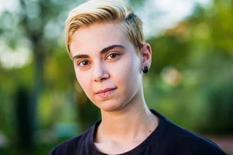 Tomboy androgynous lesbian non binary beauty in casual clothes gender lgtbi sex Stock Photos
