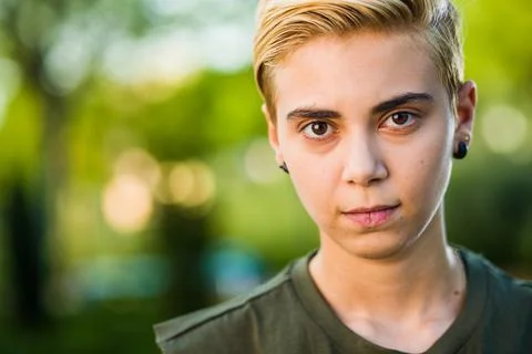 Tomboy androgynous lesbian non binary beauty in casual clothes gender lgtbi sex Stock Photos