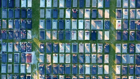 Tombs in a large cemetery with grid layout - aerial top down view Stock Footage 130015060
