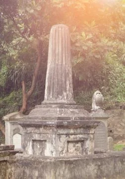 Tombstone on old graveyard sunset Stock Photos