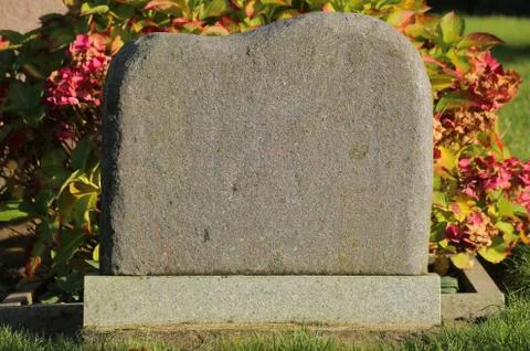 Tombstone with sunlight from the right side Stock Photos