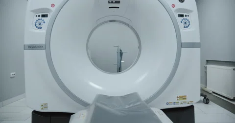 Tomograph in action. The camera moves into the magnetic resonance tunnel. Stock Footage 168833155