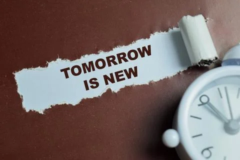 Tomorrow is new text written in torn paper. Stock Photos