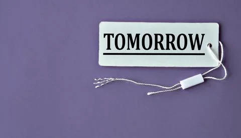 TOMORROW - word on white paper with thread on a purple background Stock Photos