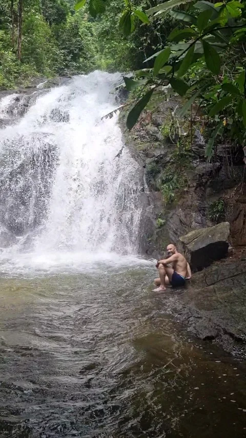 Ton Chong Fa Waterfall is a five-tiered waterfall located in Khao Lak Stock Footage 318813999