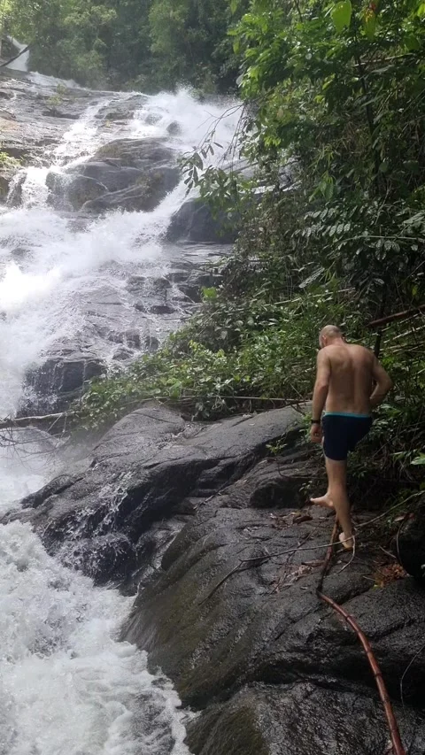 Ton Chong Fa Waterfall is a five-tiered waterfall located in Khao Lak Stock Footage 318814016