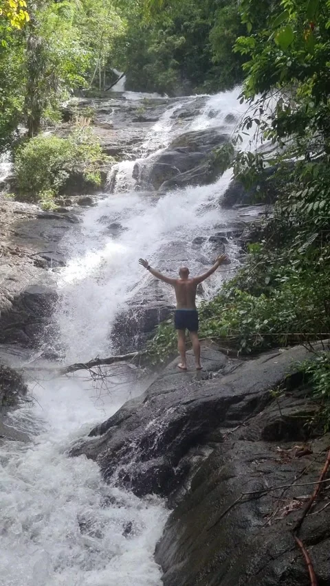 Ton Chong Fa Waterfall is a five-tiered waterfall located in Khao Lak Stock Footage 318814018
