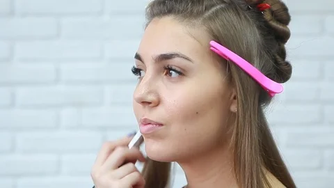 Tonal foundation makeup applied on the face of a supermodel Stock Footage 81573991