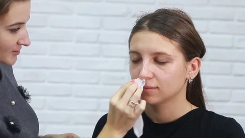 Tonal foundation makeup applied on the face of a supermodel Stock Footage 81908462