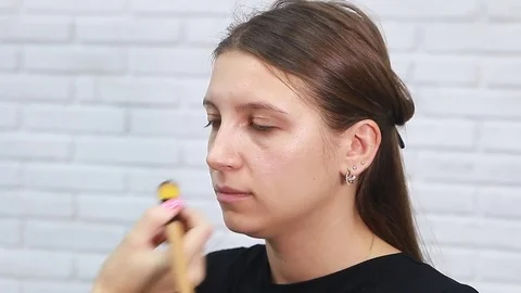 Tonal foundation makeup applied on the face of a supermodel Stock Footage 81908505