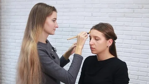 Tonal foundation makeup applied on the face of a supermodel Stock Footage 81908565