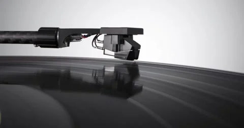 Tonearm headshell descends on vinyl record with colorful label Stock Footage 155859951
