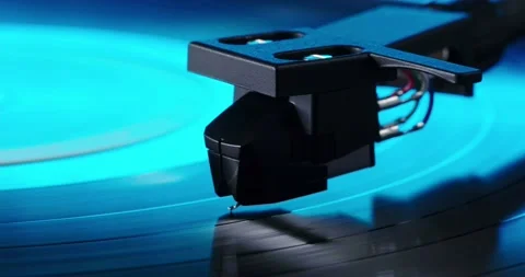 Tonearm headshell on spinning vinyl record in neon light Stock Footage 155859864