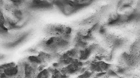 Toned in grayscale beautiful evening view on waves of sea foam on the coast of Stock Footage 238956427