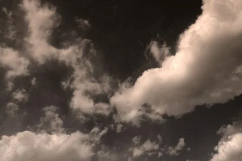 Toned image sky with white clouds backlit by sunlight Stock Photos