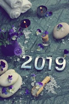 Toned image with spa set, flowers, stones and figures 2019 Stock Photos