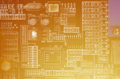 A toned macro image of a computer board with many small technological element Stock Photos