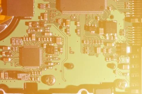 A toned macro image of a computer board with many small technological element Stock Photos