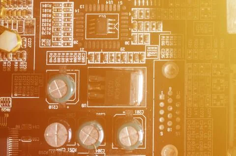 A toned macro image of a computer board with many small technological element Stock Photos