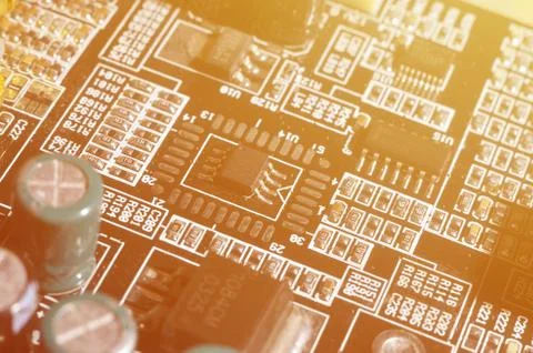 A toned macro image of a computer board with many small technological element Stock Photos