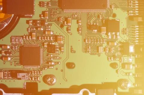 A toned macro image of a computer board with many small technological element Stock Photos