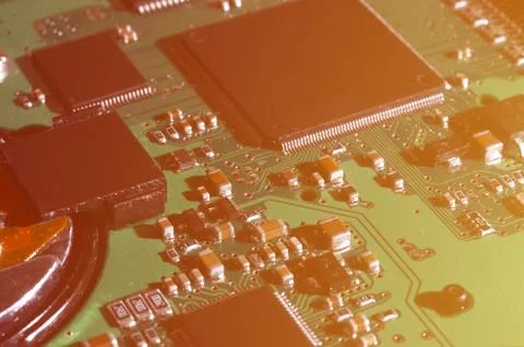 A toned macro image of a computer board with many small technological element Stock Photos