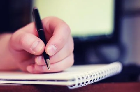 Toned man hand write pen paper Stock Photos