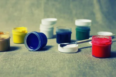 Toned set of paint cans various vintage elements on old worn backgrounds d... Stock Photos