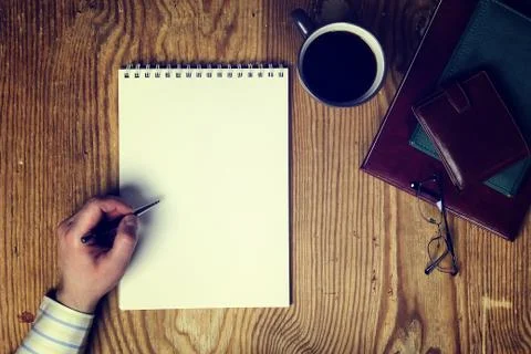 Toned table write hand top view Foto stock