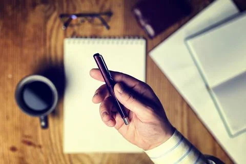 Toned table write hand top view stationery workplace office employee with ... Foto stock