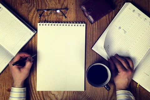 Toned table write hand top view various vintage elements on old worn backg... Foto stock