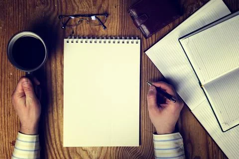 Toned table write hand top view Foto stock