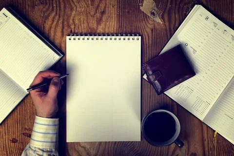 Toned table write hand top view Stock Photos