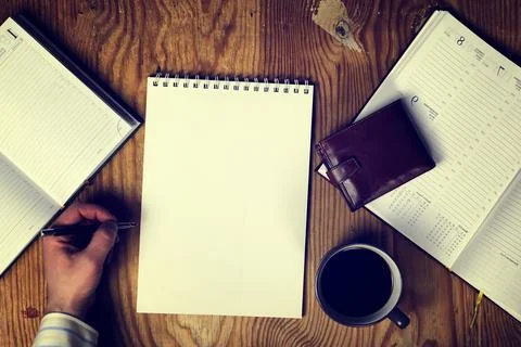 Toned table write hand top view Foto stock